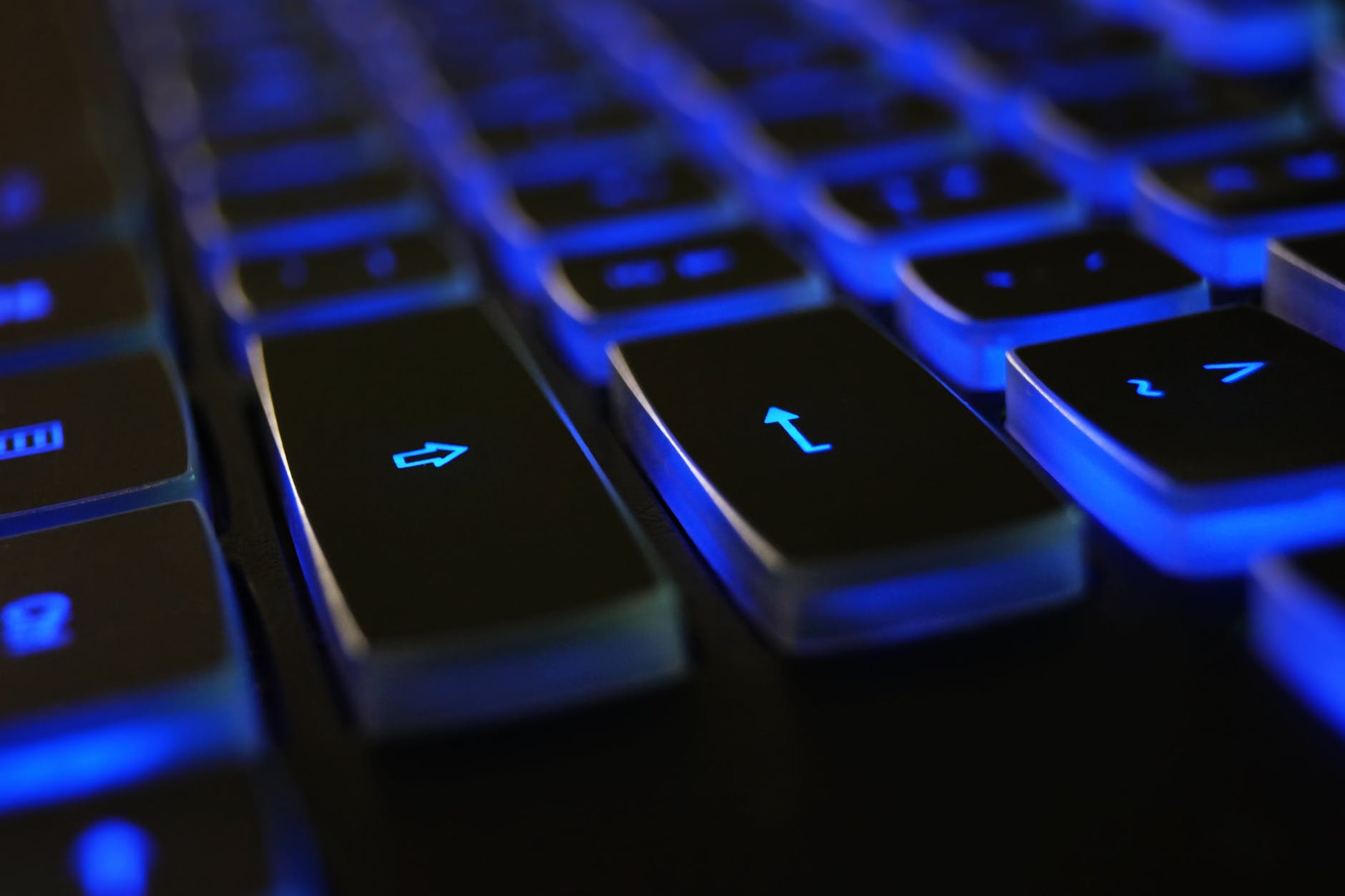 closeup photo of black and blue keyboard